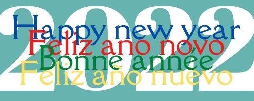 Happy new year 2022 written in English Portuguese French and Spanish